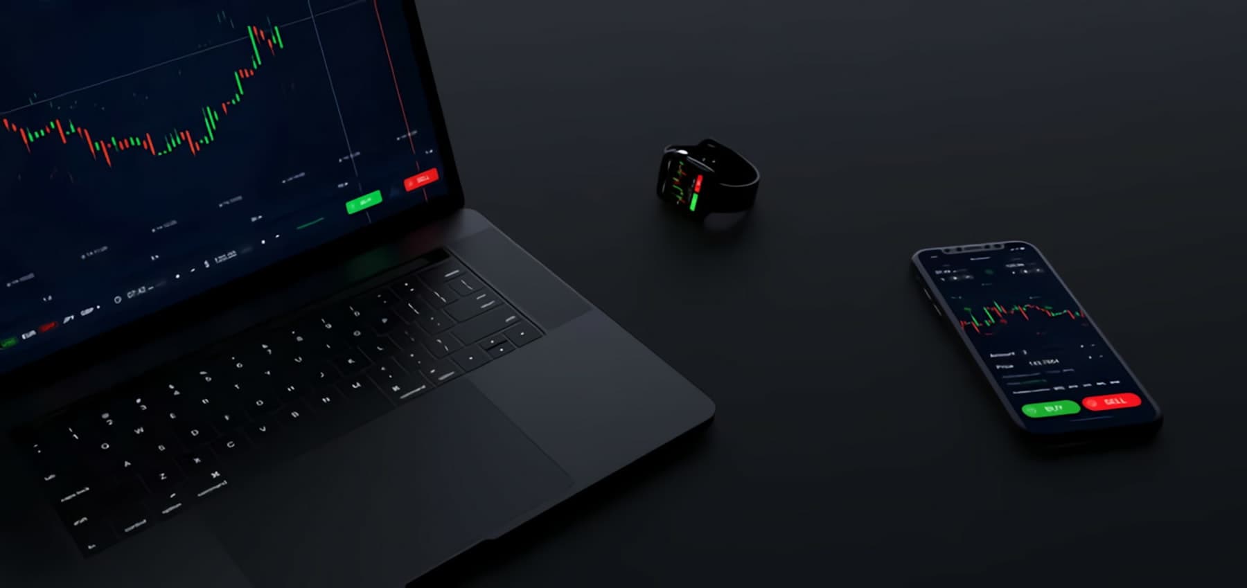 Trading desk with laptop and phone showing live charts